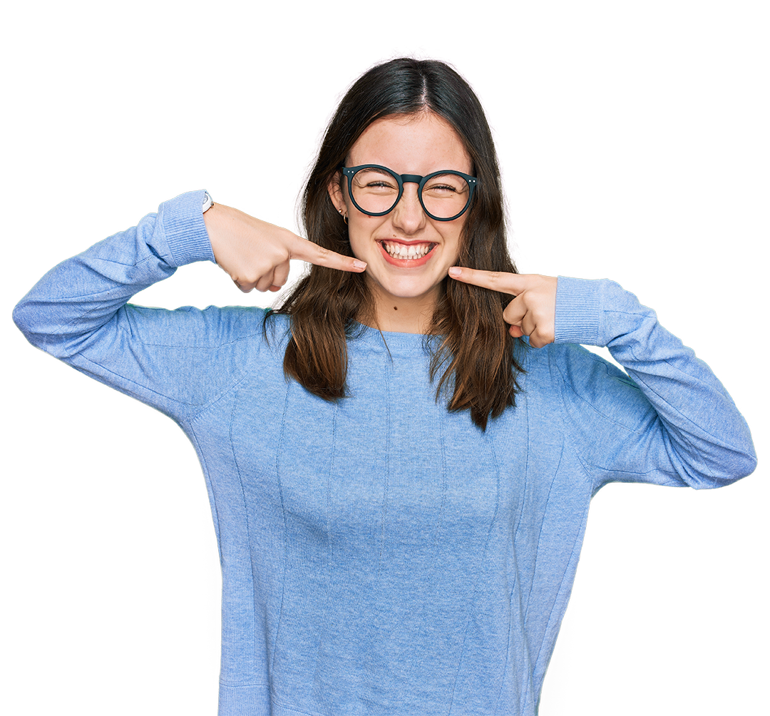 Adolescent Dental Care in Alabaster AL. A smiling teenager points to her healthy smile.