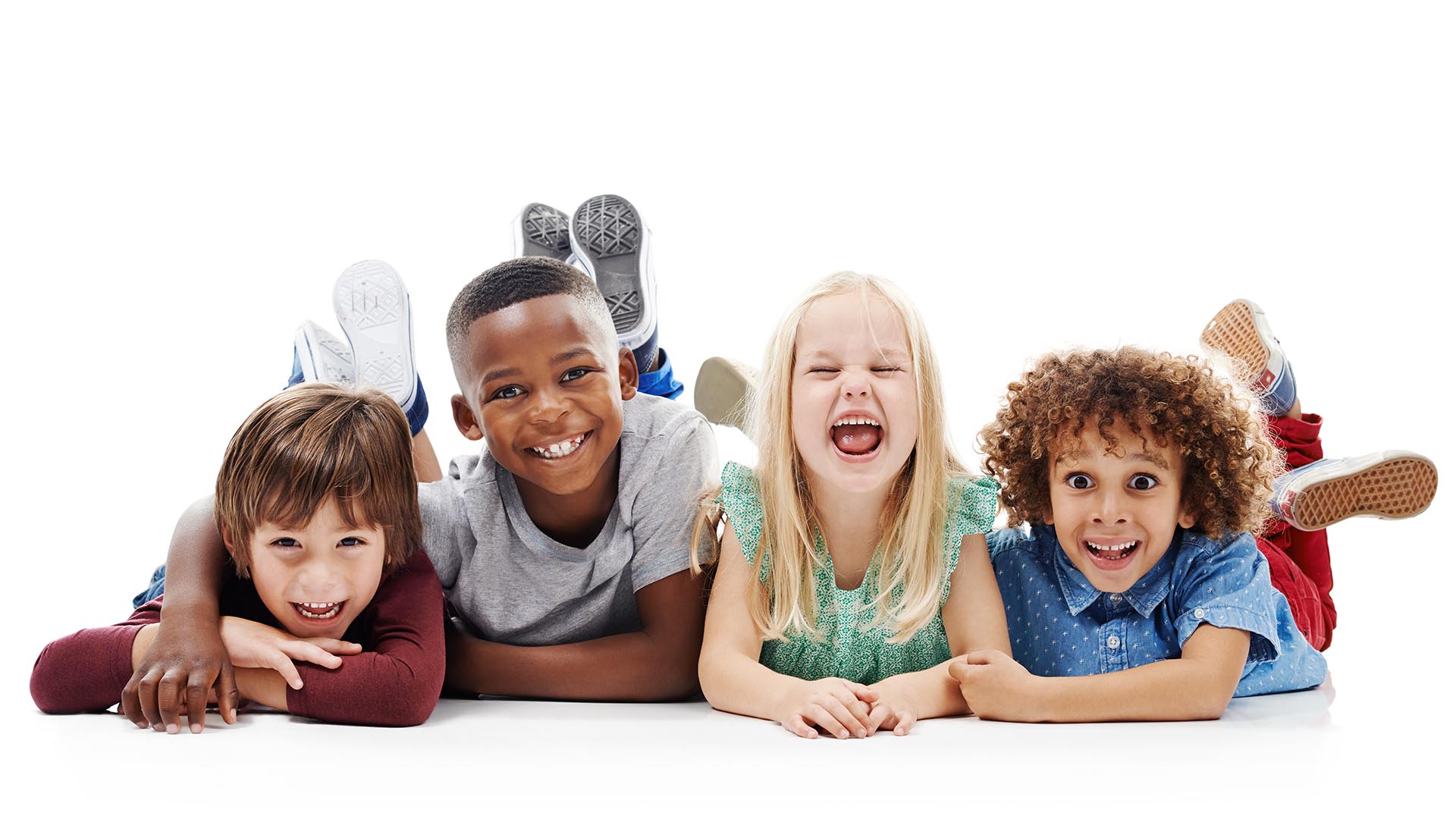 No Cavity Club. A group of children pose for the camera making silly faces.